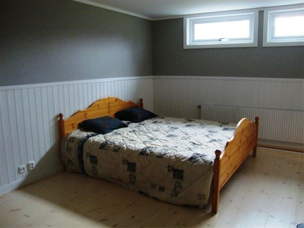 Double bed in basement. 