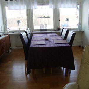 The dining table with six chairs.