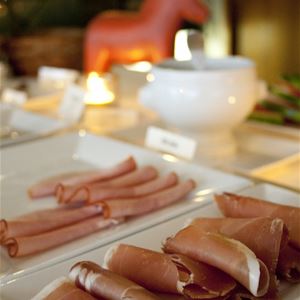 Ham on a plate during breakfast.