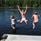 Children jumping from a jetty