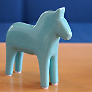 Dalecarlian wooden horse painted in light blue.