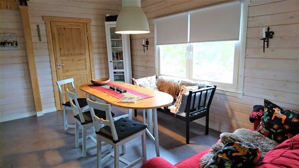 Cottage with a dining table. 
