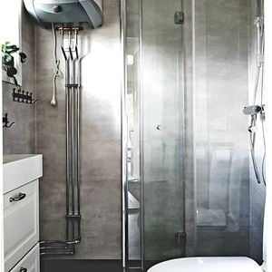 Shower with big glazed doors.