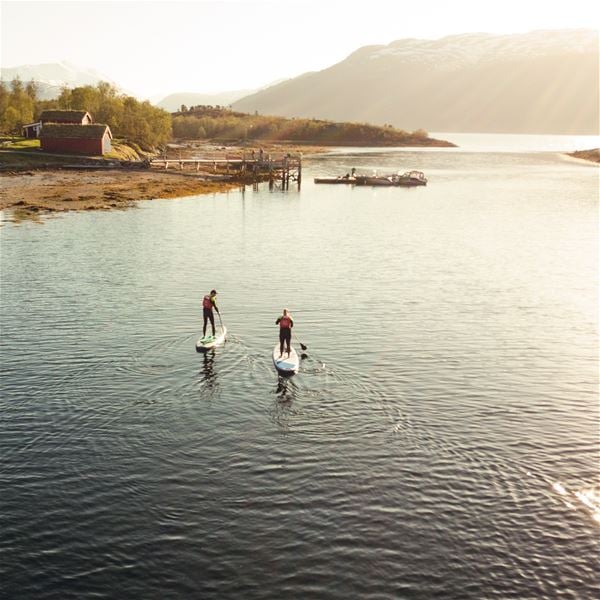  &copy; Senja Moments, Two guests stand up paddling 