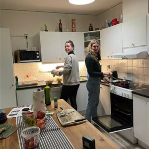 A couple making food.