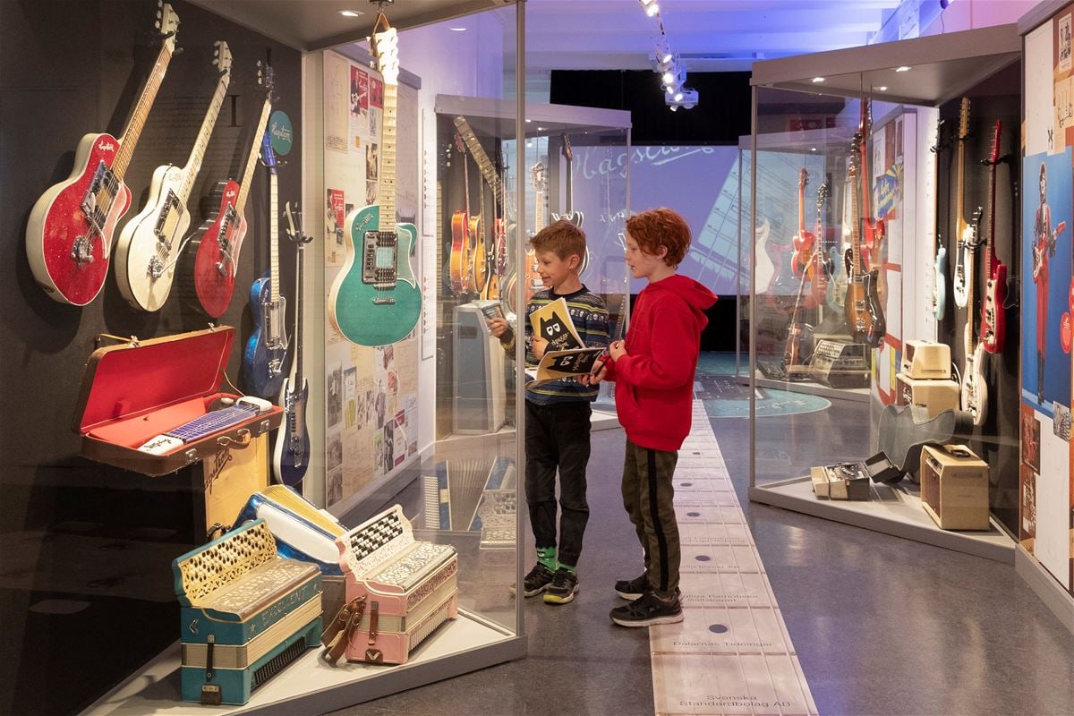 Two children looking at a exhibition.