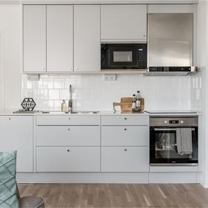 Kitchen with white cupboards. 