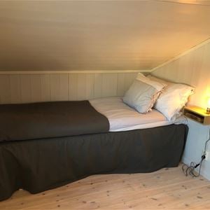 Single bed under sloping roof. 