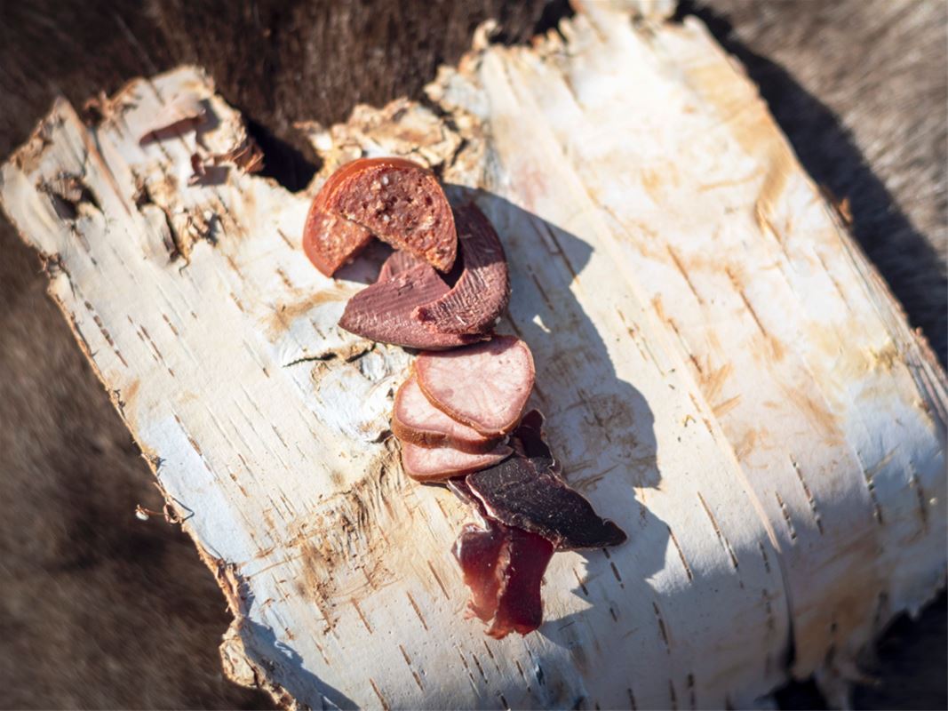 Cold cut on birch wood outdoors.
