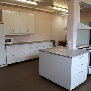 Large kitchen with stove, oven, fridge, freezer and microwave. 