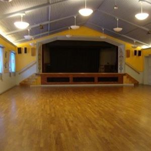 Large room with stage. 