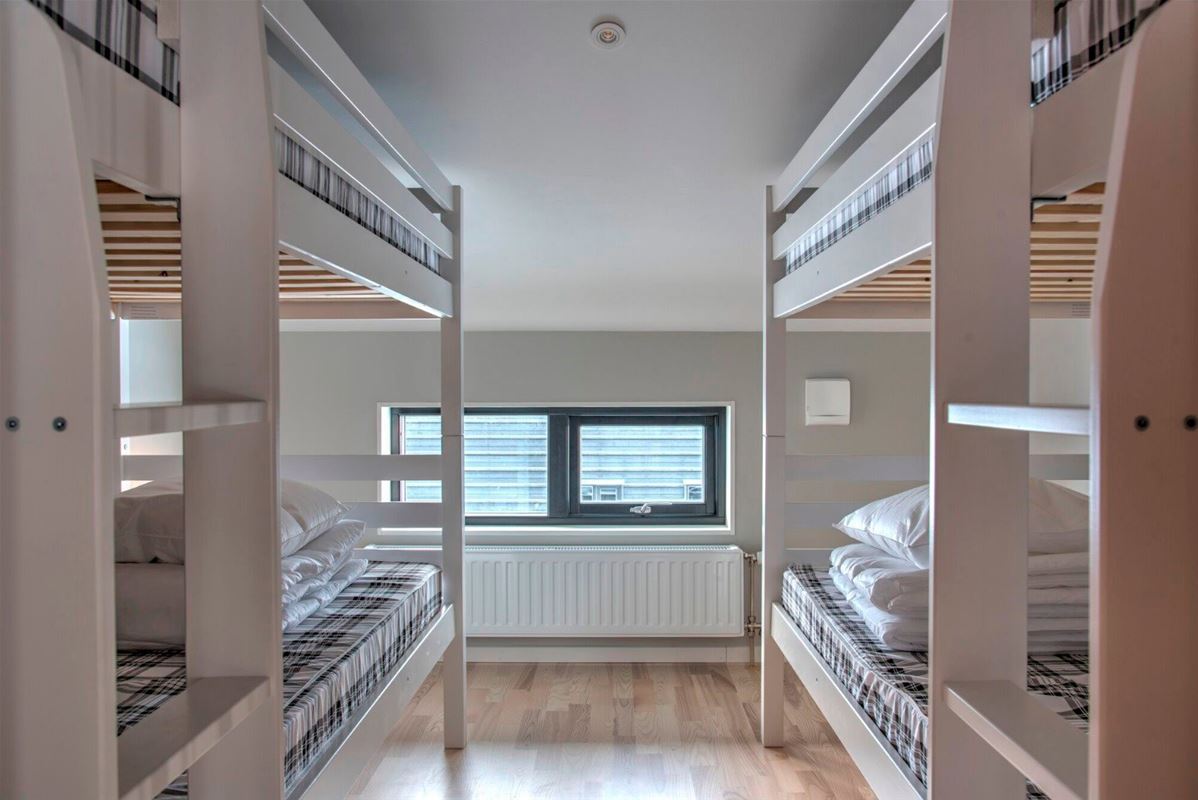 Two bunkbeds in the bedroom. 