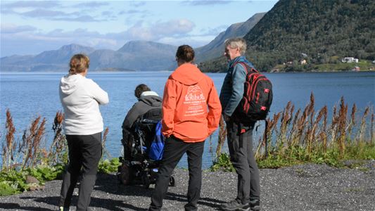 Four guests enjoying the view of the sea and the mountains