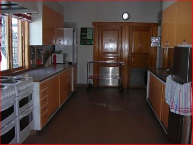 Big kitchen with two stoves.