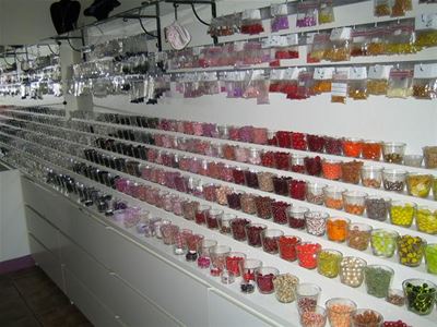  a wall filled with small glasses.