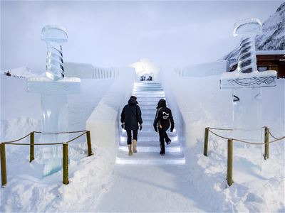 Walking the snow-carved stairs to Tromsø Ice Domes