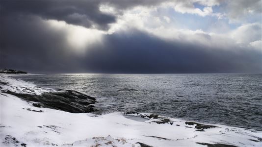 Coastal view, with dark clouds