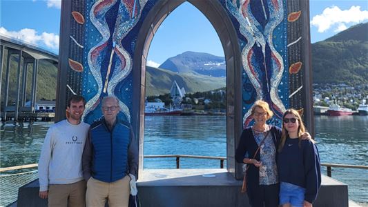 A family in front of the Gateway to the Arctic