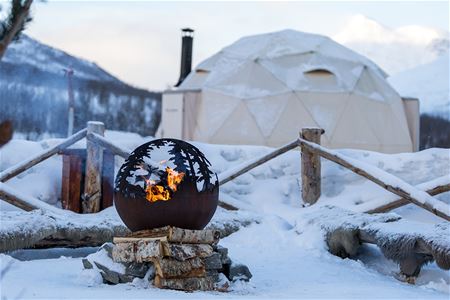 Stylised campfire beside the overnight dome