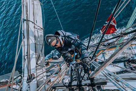 A person working on the sail