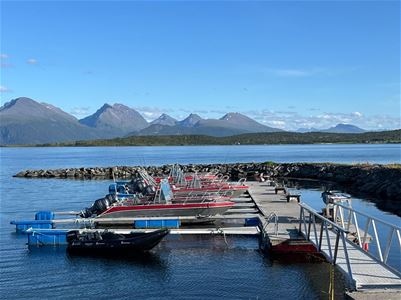Boats at the marina with mountains in the background