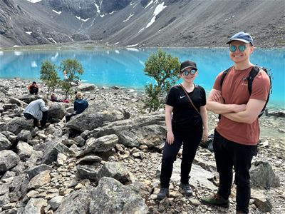 Guests take a photo by the Blåisvatnet lake