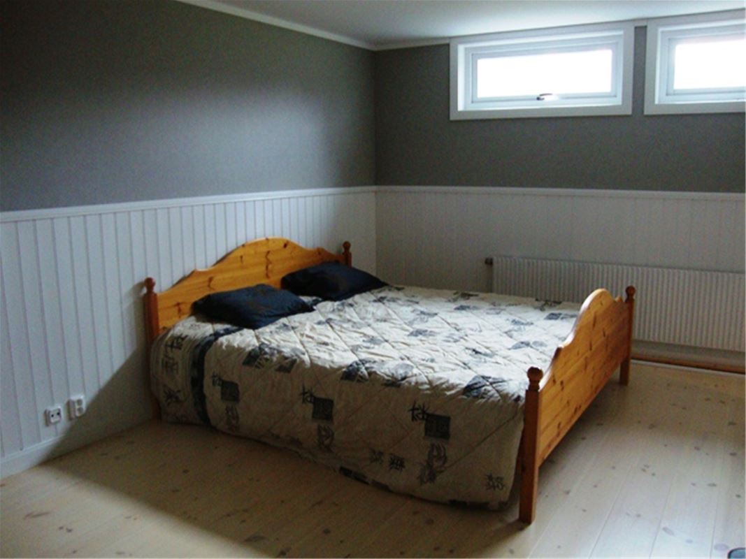 Double bed in basement.