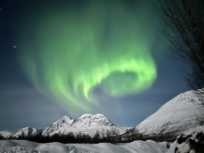 Northern lights and snow covered mountains