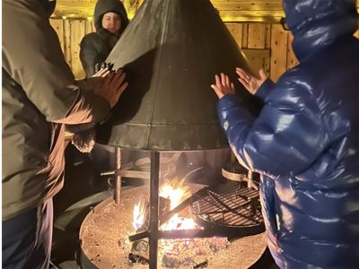 Guests around a campfire
