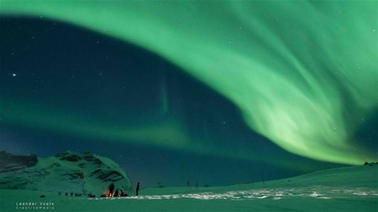 Northern lights above Arctic winter landscape