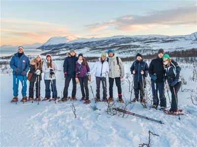 Guests posing with snowshoes