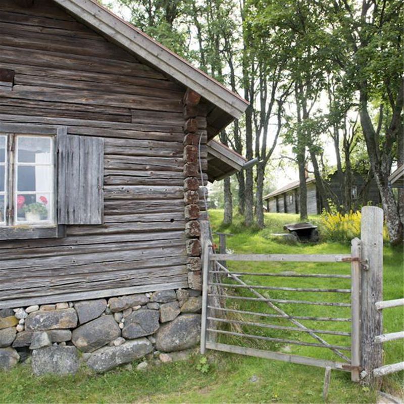Part of a chalet cottage with gate into the yard.