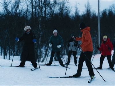 Guests try the "fish legs" technique on skis