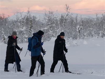 Skiing through the snow.