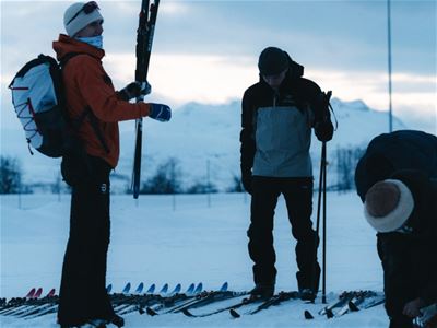 Guests learn how to attach the skis