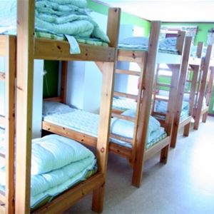 Bedroom with several bunk beds.