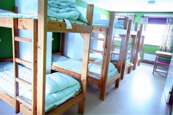 Bedroom with several bunk beds. 