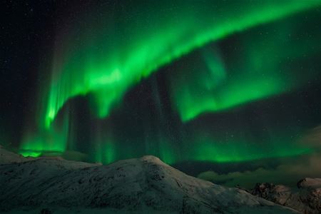 Northern lights over mountains