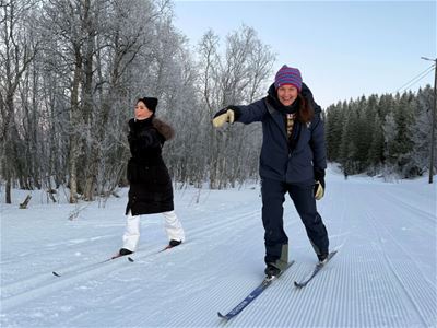 Smiling guest and guide at the Cross-Country skiing course