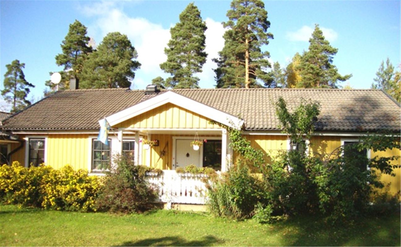 Exterior of a yellow painted house.