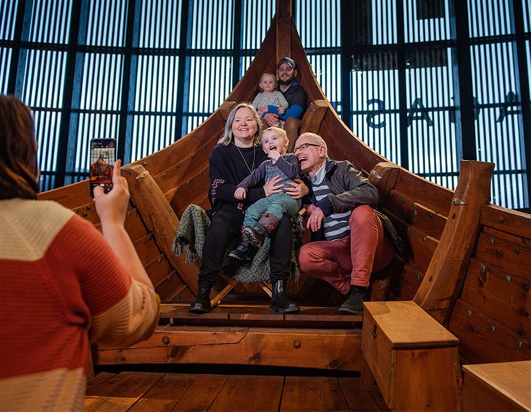 Multiple generations experiencing the Myklebust Ship together inside Sagastad Viking Center.