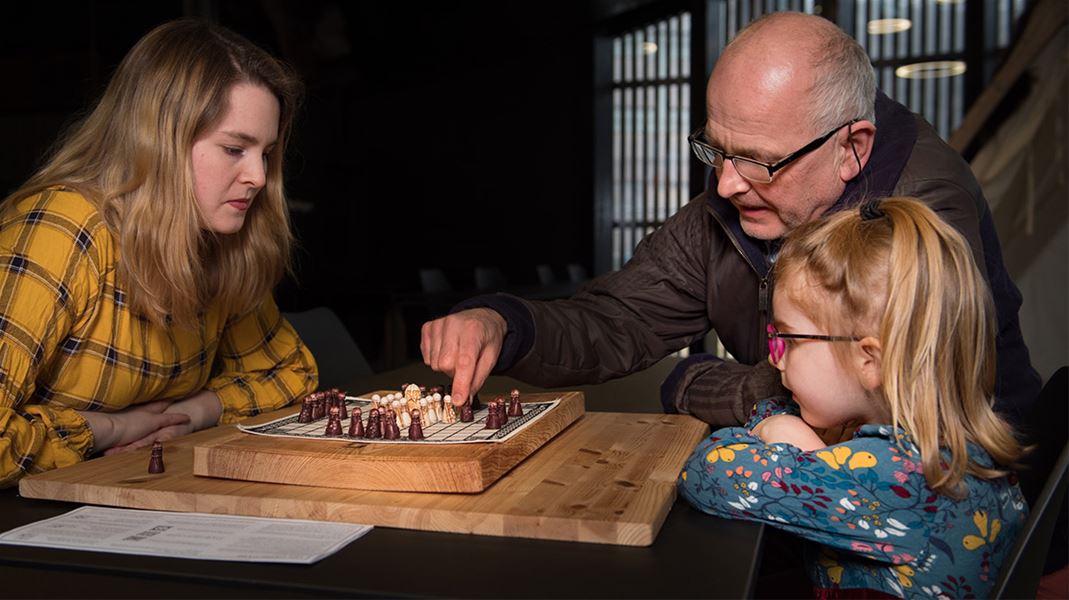 A family participating in games and activities in the exhibition at Sagastad Viking Center.