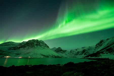 Aurora forms a mass above the mountains