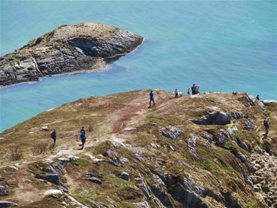 Guests hiking down from the peak