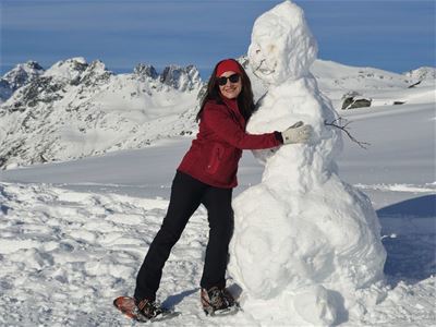 Guest hugging a snowman