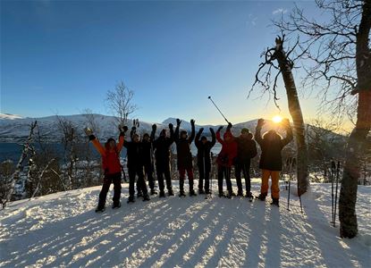 Group of happy guests on snowshoes