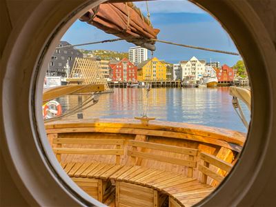View towards the quay in Tromsø from inside the boat