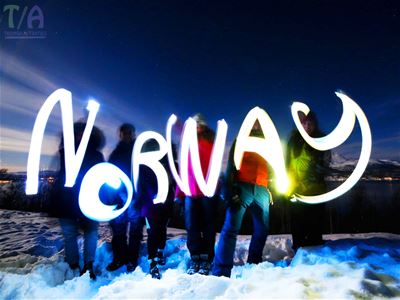 Guests spelling "Norway" with flashlights