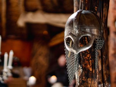 Guests listening to stories about Viking life and culture inside one of the buildings at the Viking village.
