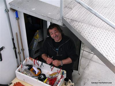 Fishing gear and lures being prepared on board for a sea fishing trip with Sørøya Havfiske.